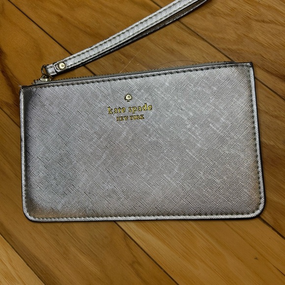kate spade Handbags - Kate Spade Silver Wristlet Wristlet